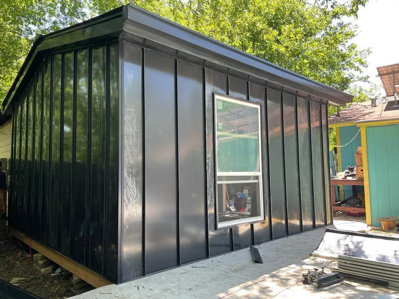 Black standing seam metal wall panels for Roof Inspection in Oelwein